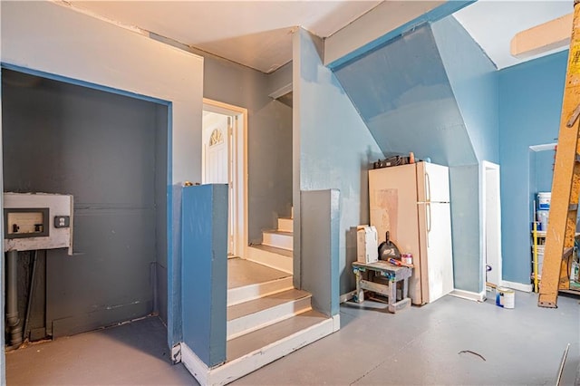 interior space featuring finished concrete flooring