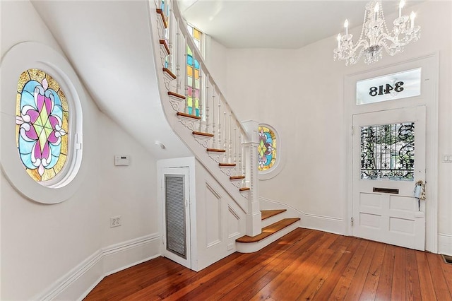 3418 Coliseum St, New Orleans, LA 70115 - foyer entrance featuring stairway, hardwood / wood-style floors, visible vents, and a notable chandelier