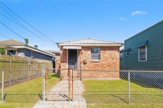 2617 Danneel St, New Orleans, LA 70113 - bungalow-style house with brick siding, a front lawn, fence, and a gate