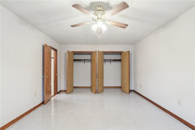 2617 Danneel St, New Orleans, LA 70113 - unfurnished bedroom featuring two closets, light floors, a textured ceiling, a ceiling fan, and baseboards