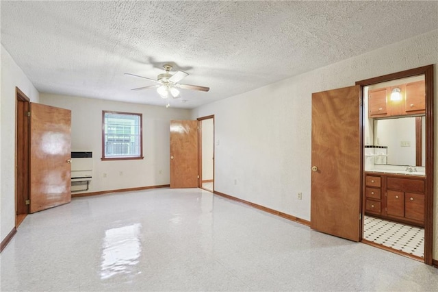 2617 Danneel St, New Orleans, LA 70113 - interior space with a textured ceiling, ceiling fan, baseboards, and a sink