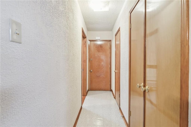 2617 Danneel St, New Orleans, LA 70113 - corridor with a textured ceiling and a textured wall
