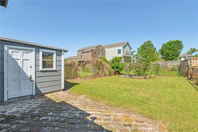2617 Danneel St, New Orleans, LA 70113 - view of yard with an outbuilding, a fenced backyard, and a shed