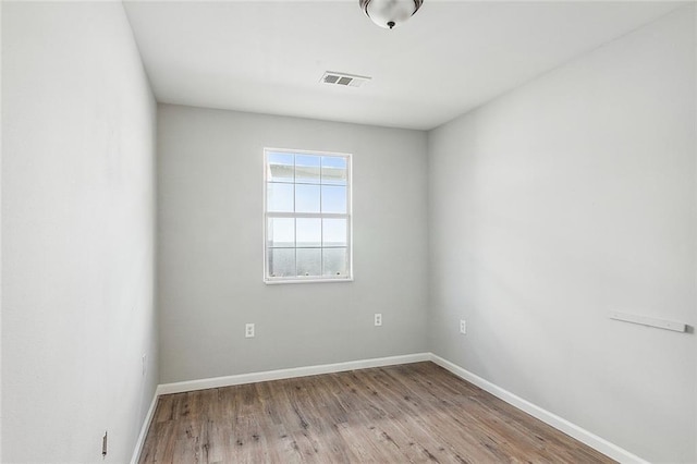 3702 Monroe St, New Orleans, LA 70118 - empty room with baseboards, visible vents, and wood finished floors
