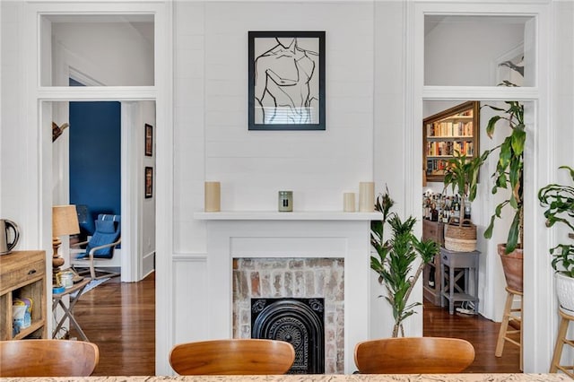 living area featuring a fireplace and wood finished floors