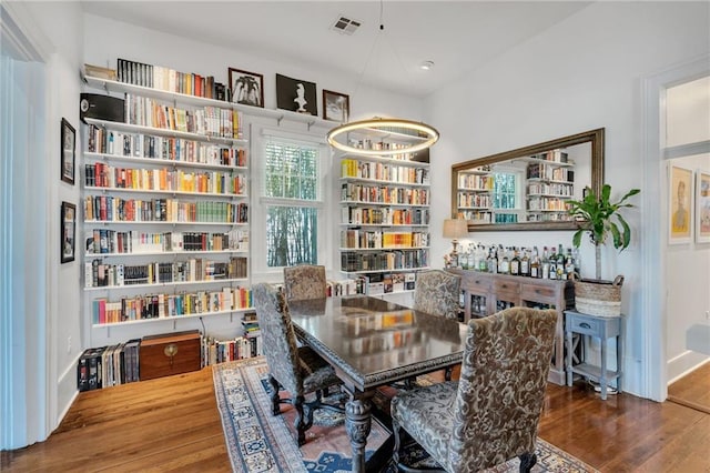 dining area featuring visible vents, recessed lighting, and wood finished floors