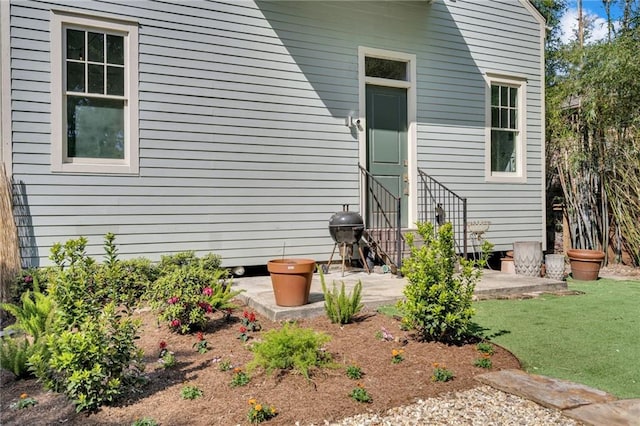 doorway to property with a patio area