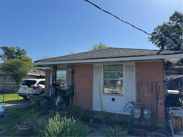 71315 Bell St, Metairie, LA 70003 - view of property exterior featuring brick siding and fence