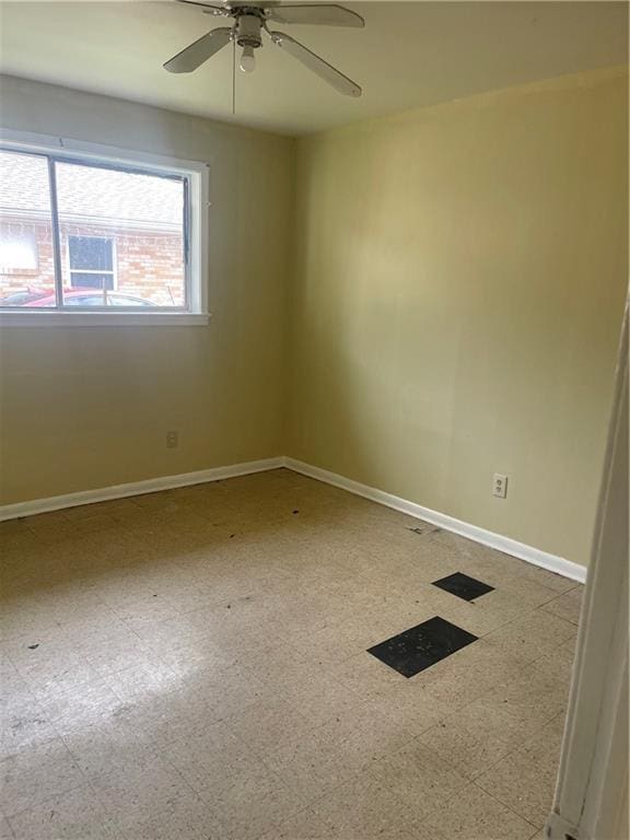 71315 Bell St, Metairie, LA 70003 - spare room featuring baseboards, ceiling fan, and tile patterned floors