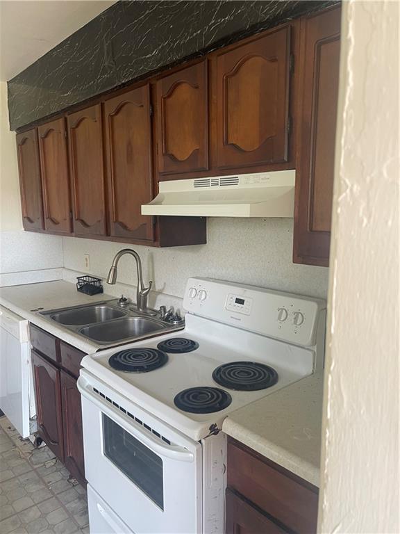71315 Bell St, Metairie, LA 70003 - kitchen with electric stove, under cabinet range hood, a sink, light countertops, and dishwasher