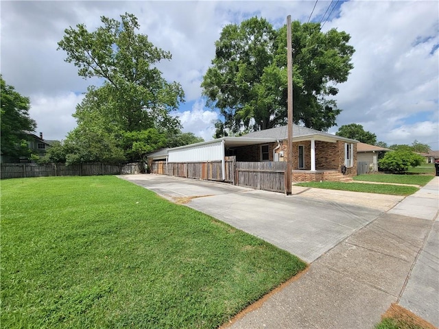 2202 Fazzio Rd, Chalmette, LA 70043 - exterior space featuring a front yard, fence, and brick siding