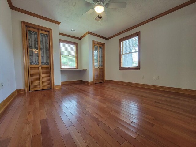 2202 Fazzio Rd, Chalmette, LA 70043 - empty room with a wealth of natural light, wood-type flooring, visible vents, and ceiling fan