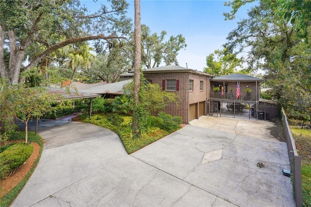 711 Roseland Pkwy, Harahan, LA 70123 - view of front of property with driveway, a garage, and brick siding