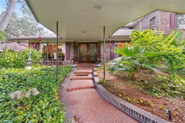 711 Roseland Pkwy, Harahan, LA 70123 - doorway to property featuring french doors and brick siding