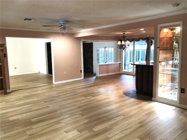 711 Roseland Pkwy, Harahan, LA 70123 - unfurnished room featuring crown molding, a textured ceiling, a chandelier, light wood-style flooring, and ceiling fan