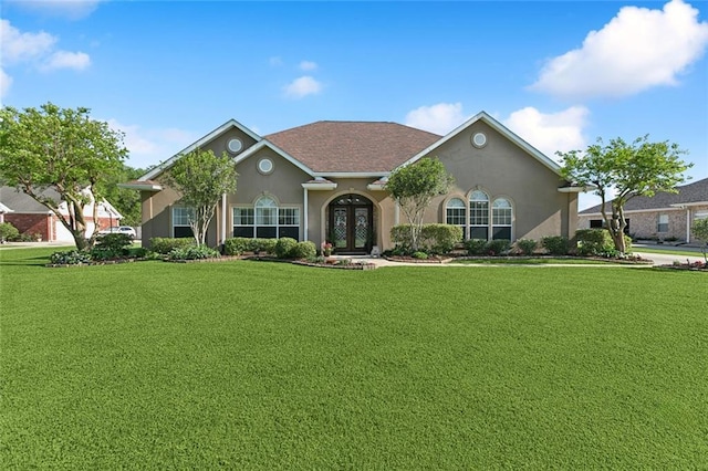 155 Maud Olive Dr, Belle Chasse, LA 70037 - ranch-style home featuring french doors, a front yard, and stucco siding