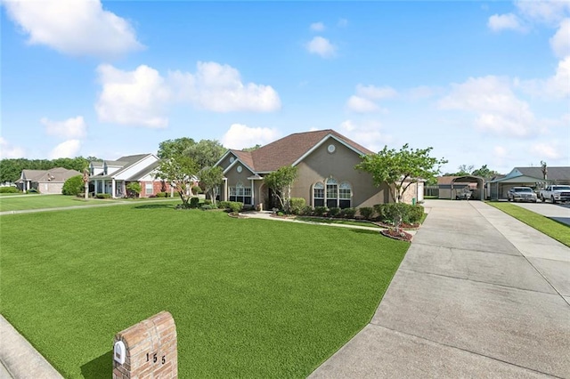 155 Maud Olive Dr, Belle Chasse, LA 70037 - single story home with a front yard, a carport, concrete driveway, stucco siding, and a residential view