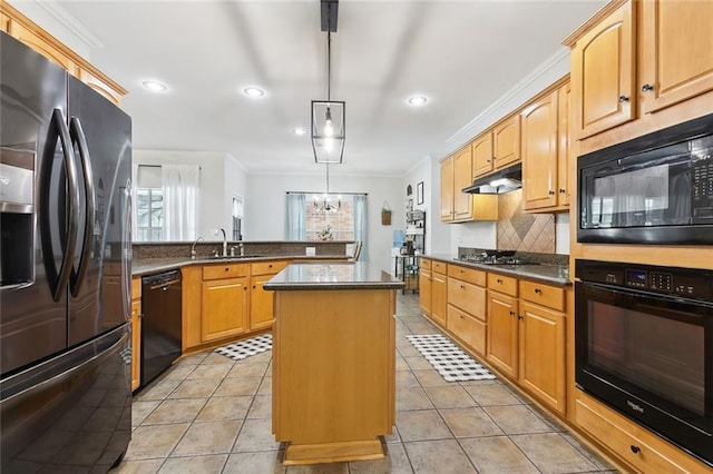 155 Maud Olive Dr, Belle Chasse, LA 70037 - kitchen with a peninsula, ornamental molding, black appliances, a center island, and under cabinet range hood