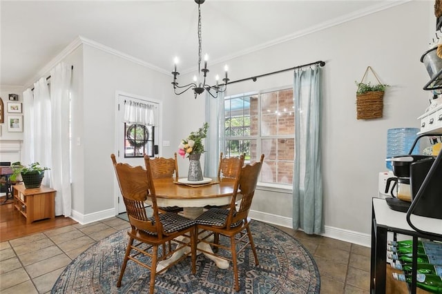 155 Maud Olive Dr, Belle Chasse, LA 70037 - tiled dining area with an inviting chandelier, baseboards, and ornamental molding