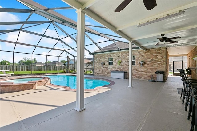 155 Maud Olive Dr, Belle Chasse, LA 70037 - view of pool with a lanai, a patio area, a pool with connected hot tub, and fence
