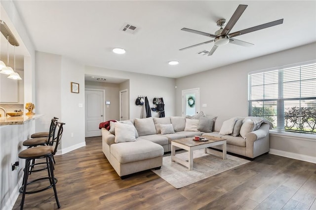 309 Allie Ln, Luling, LA 70070 - living room featuring ceiling fan, visible vents, baseboards, and dark wood finished floors