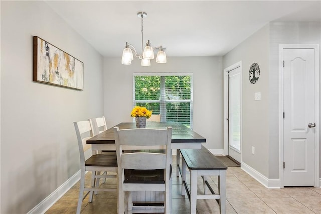 309 Allie Ln, Luling, LA 70070 - dining space featuring light tile patterned floors, a notable chandelier, and baseboards