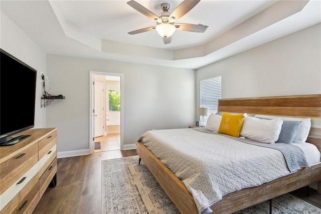 309 Allie Ln, Luling, LA 70070 - bedroom with ceiling fan, visible vents, dark wood-style flooring, a raised ceiling, and baseboards