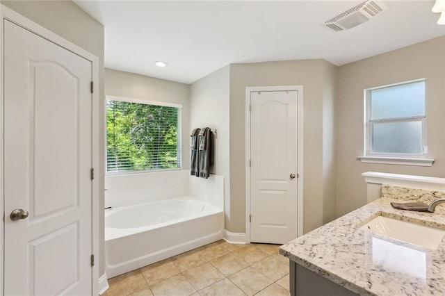 309 Allie Ln, Luling, LA 70070 - full bathroom with a bath, vanity, tile patterned flooring, visible vents, and baseboards