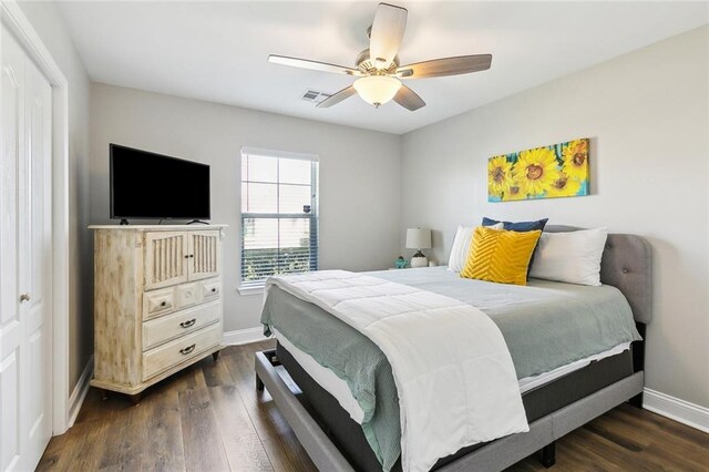 309 Allie Ln, Luling, LA 70070 - bedroom with dark wood-type flooring, visible vents, and baseboards
