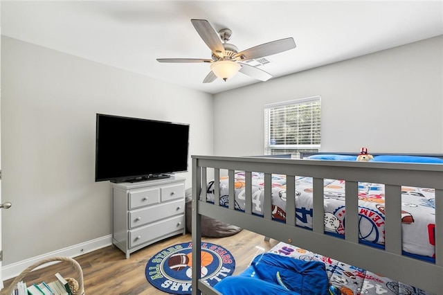 309 Allie Ln, Luling, LA 70070 - bedroom with wood finished floors, ceiling fan, and baseboards