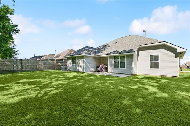 309 Allie Ln, Luling, LA 70070 - rear view of property with a patio area, a shingled roof, fence, and a lawn