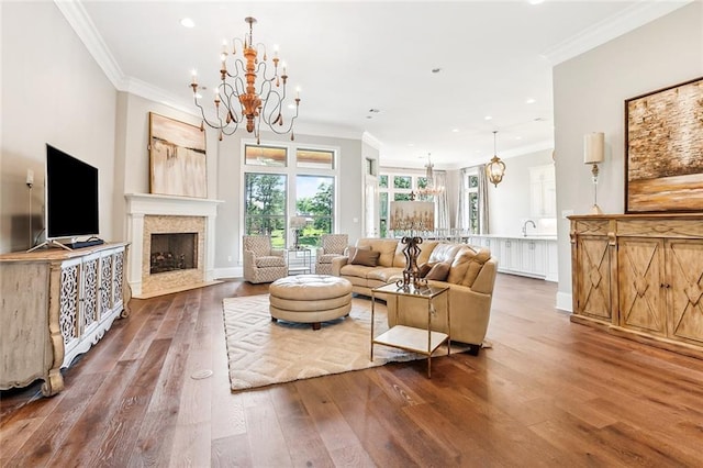 living room with a chandelier, recessed lighting, and wood-type flooring