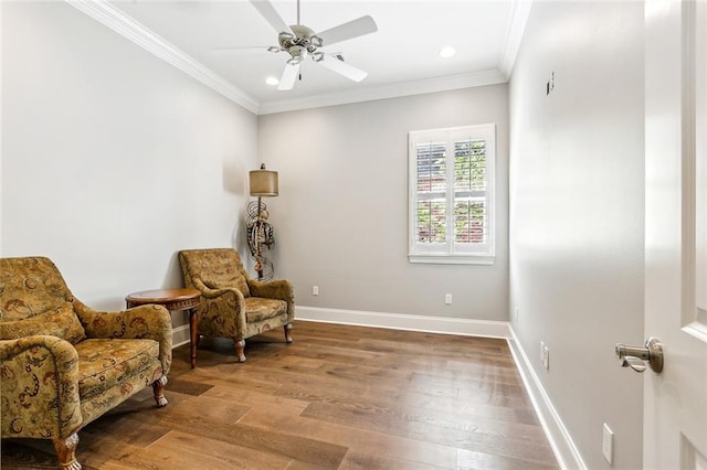 sitting room featuring crown molding, ceiling fan, recessed lighting, wood finished floors, and baseboards