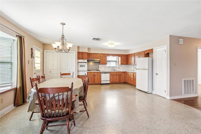 6505 Carmen St, Metairie, LA 70003 - dining area featuring baseboards, a notable chandelier, visible vents, and light speckled floor