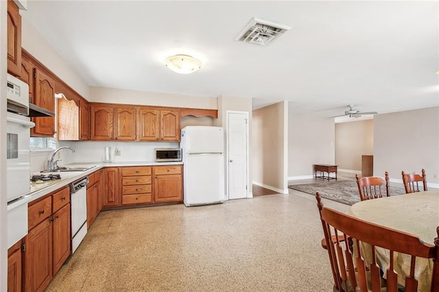 6505 Carmen St, Metairie, LA 70003 - kitchen with ceiling fan, white appliances, visible vents, a sink, and light countertops