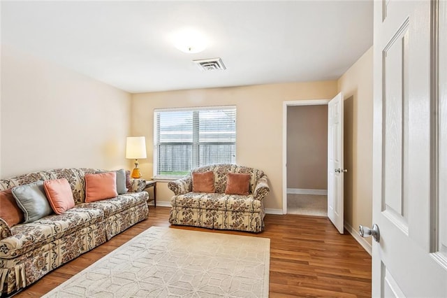 6505 Carmen St, Metairie, LA 70003 - living area featuring wood finished floors, baseboards, and visible vents
