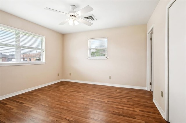 6505 Carmen St, Metairie, LA 70003 - unfurnished bedroom featuring visible vents, baseboards, ceiling fan, and wood finished floors