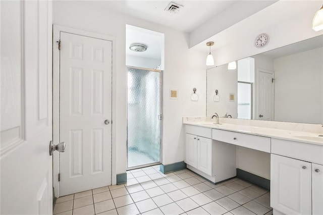 6505 Carmen St, Metairie, LA 70003 - bathroom with double vanity, tile patterned flooring, an enclosed shower, visible vents, and a sink