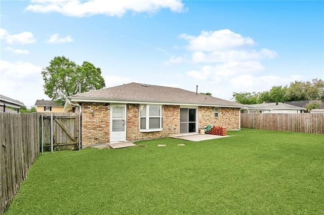 6505 Carmen St, Metairie, LA 70003 - rear view of property featuring a shingled roof, brick siding, a fenced backyard, and a lawn