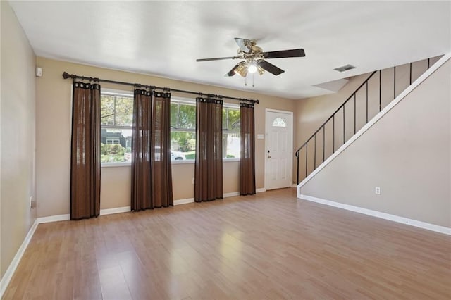 10012 Joel Ave, River Ridge, LA 70123 - interior space featuring visible vents, light wood-style floors, baseboards, stairway, and a ceiling fan