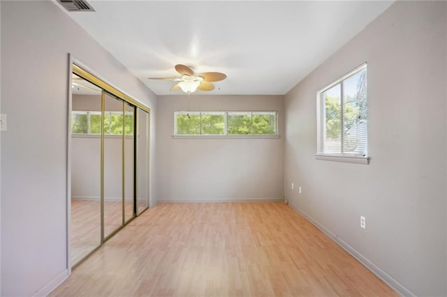 10012 Joel Ave, River Ridge, LA 70123 - unfurnished bedroom featuring a ceiling fan, visible vents, baseboards, a closet, and light wood-style floors