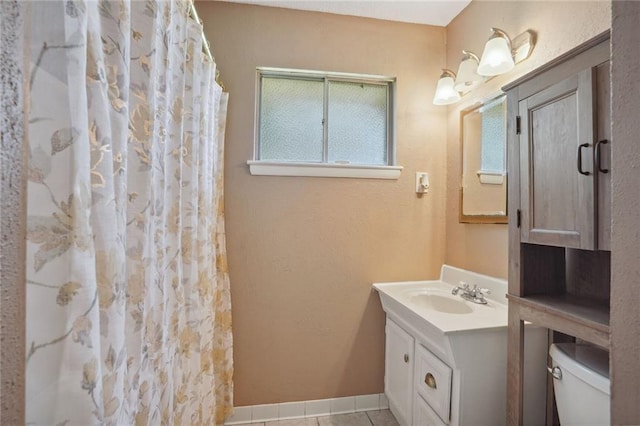 10012 Joel Ave, River Ridge, LA 70123 - bathroom with vanity, tile patterned flooring, a shower with curtain, and toilet