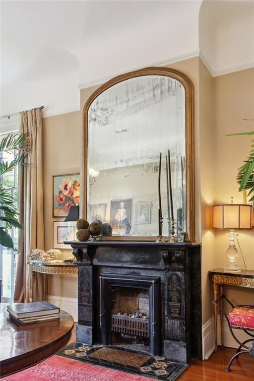 3611 Carondelet St, New Orleans, LA 70115 - living area with baseboards, a fireplace with flush hearth, and wood finished floors