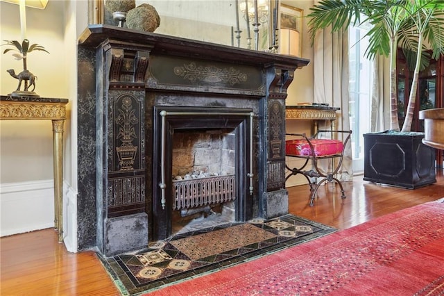 3611 Carondelet St, New Orleans, LA 70115 - details with a fireplace with flush hearth, wainscoting, and wood finished floors