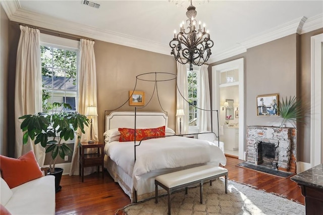 3611 Carondelet St, New Orleans, LA 70115 - bedroom featuring visible vents, ornamental molding, wood finished floors, and a chandelier