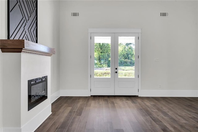 doorway featuring dark wood-type flooring, visible vents, and french doors