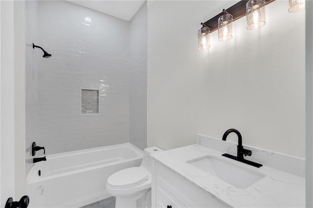 bathroom featuring bathing tub / shower combination, vanity, and toilet