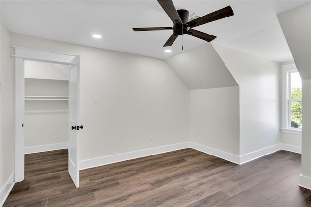 additional living space with a ceiling fan, recessed lighting, dark wood-style flooring, lofted ceiling, and baseboards