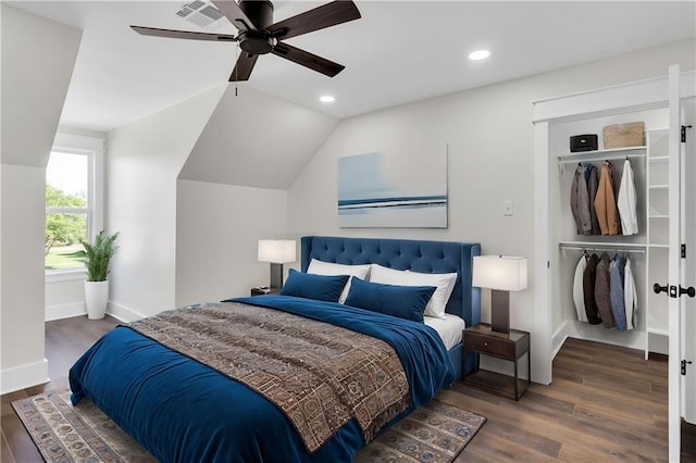 bedroom featuring a closet, recessed lighting, wood finished floors, and lofted ceiling