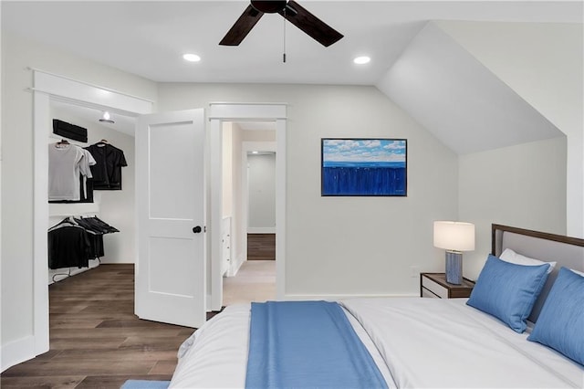 bedroom with ceiling fan, recessed lighting, wood finished floors, and lofted ceiling